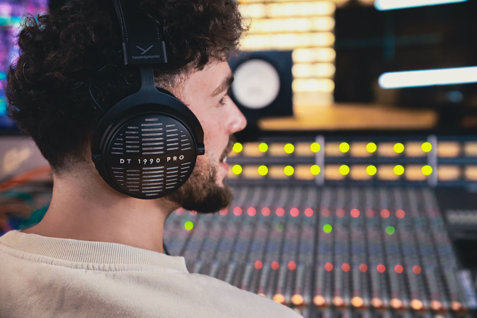 Man wearing beyerdynamic DT 1990 PRO MKII headphones.