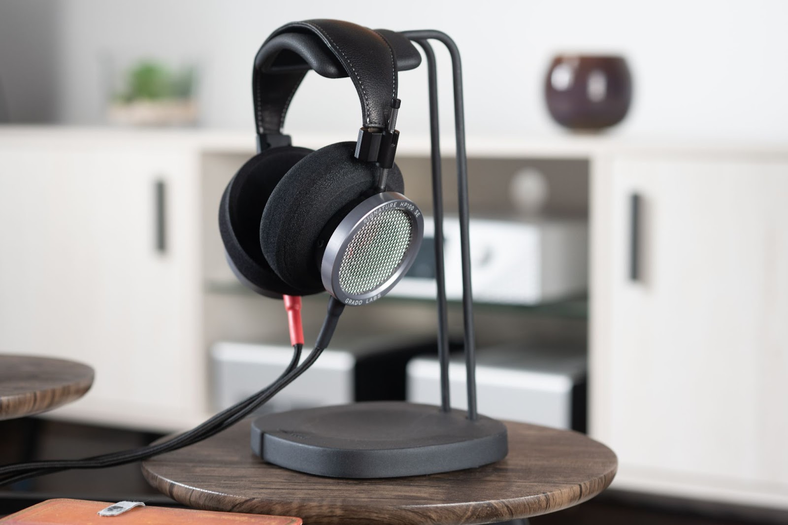 Grado Signature HP100 SE on headphone stand.